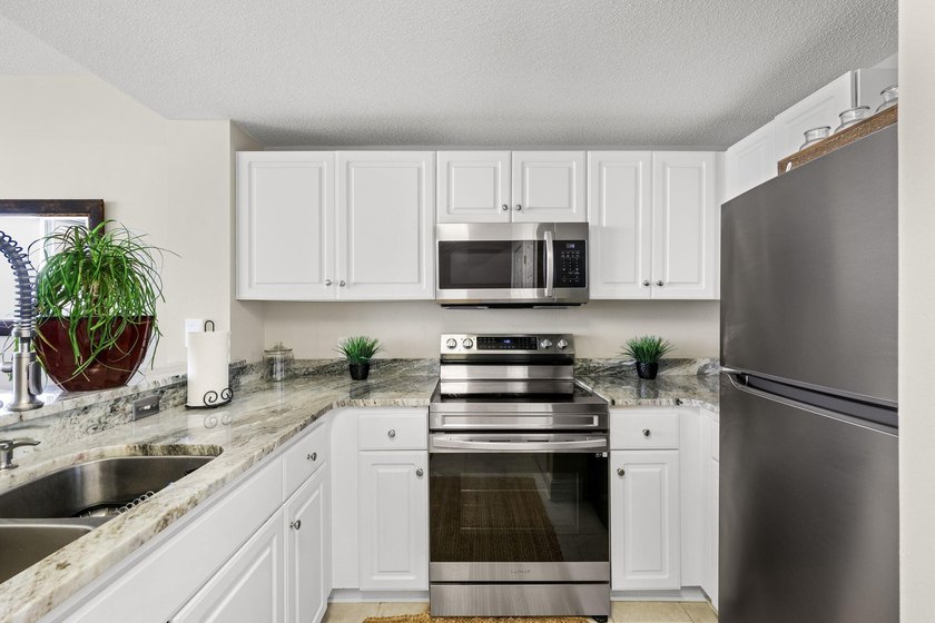 Wake up to sweeping Gulf views from this beautifully updated - photo 19
