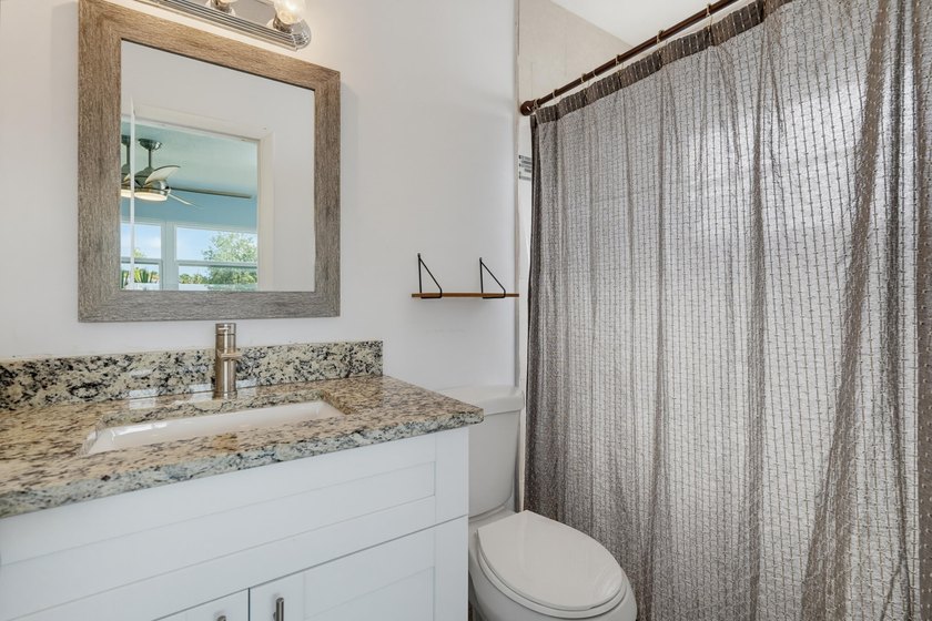 Welcome home to this charming three bedroom, two bathroom single - photo 18