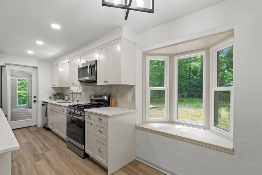 Perched on a private wooded hill with seasonal views of Silver - photo 10