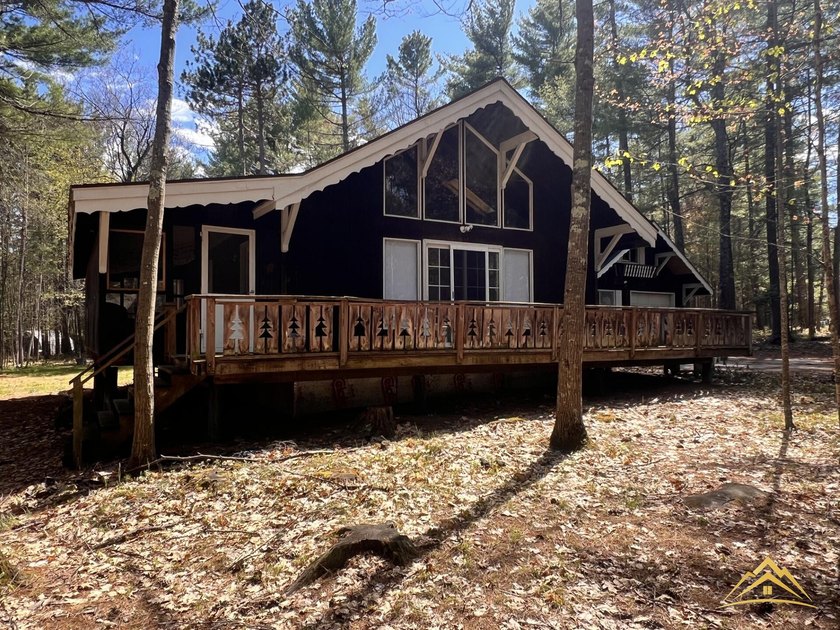 Tucked among the pines of Au Sable Acres, this fully furnished - photo 26