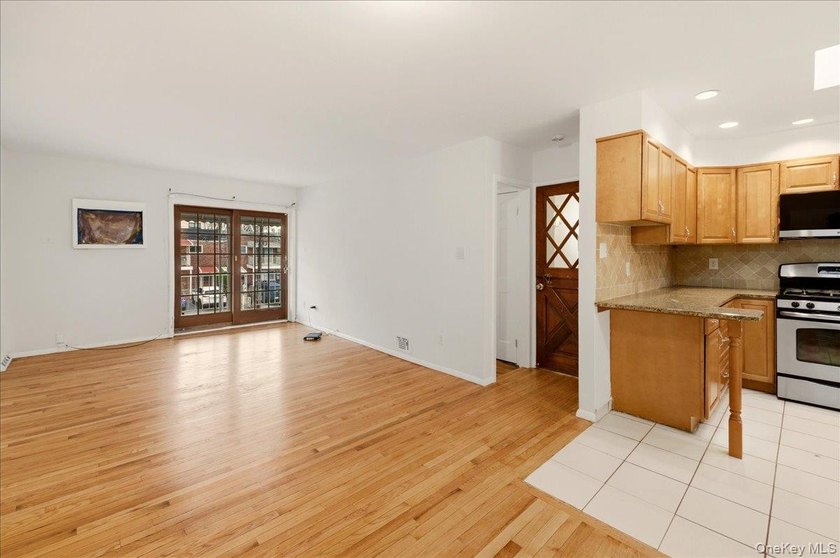 Welcome to this charming two-family Colonial-style duplex in the - photo 4