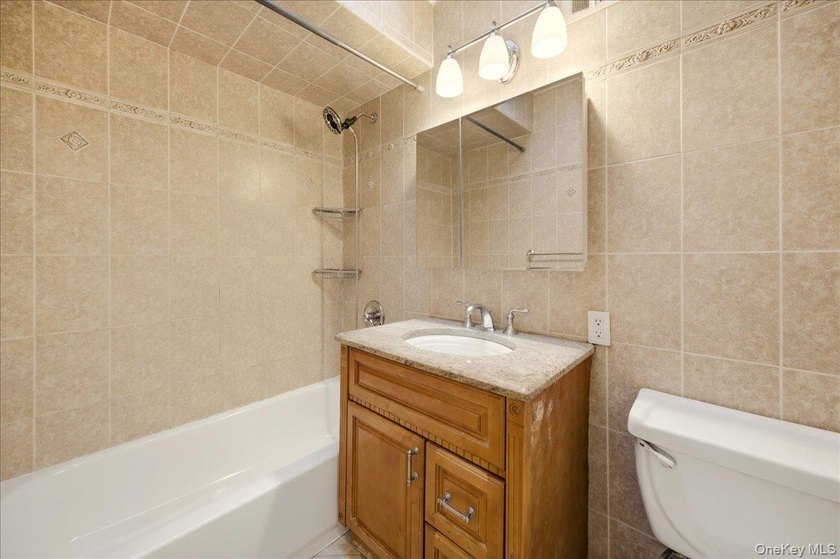Welcome to this charming two-family Colonial-style duplex in the - photo 10