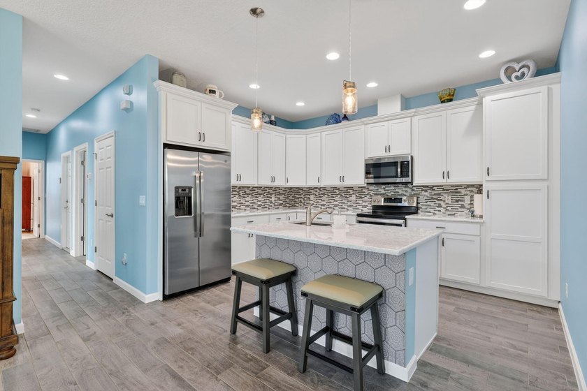 Experience low-maintenance living in LakePark at Tradition, an - photo 12