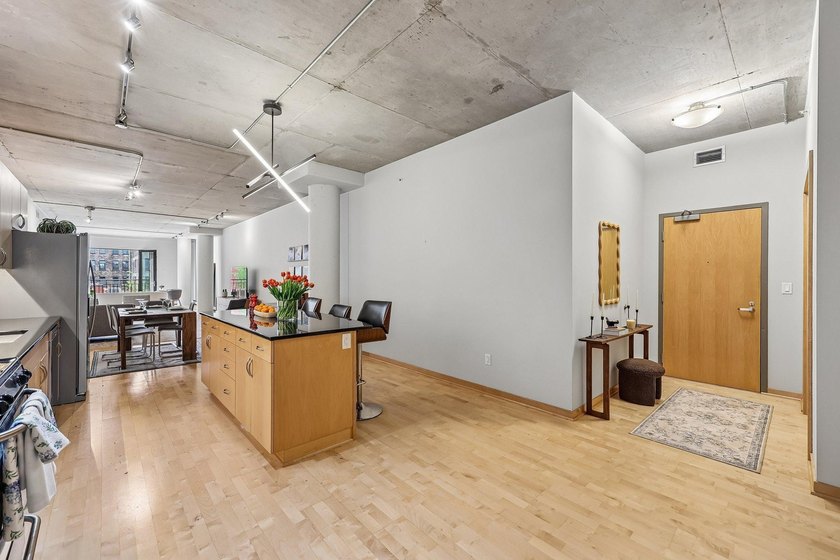 Welcome to 212 Lofts, where city living feels open, bright, and - photo 11