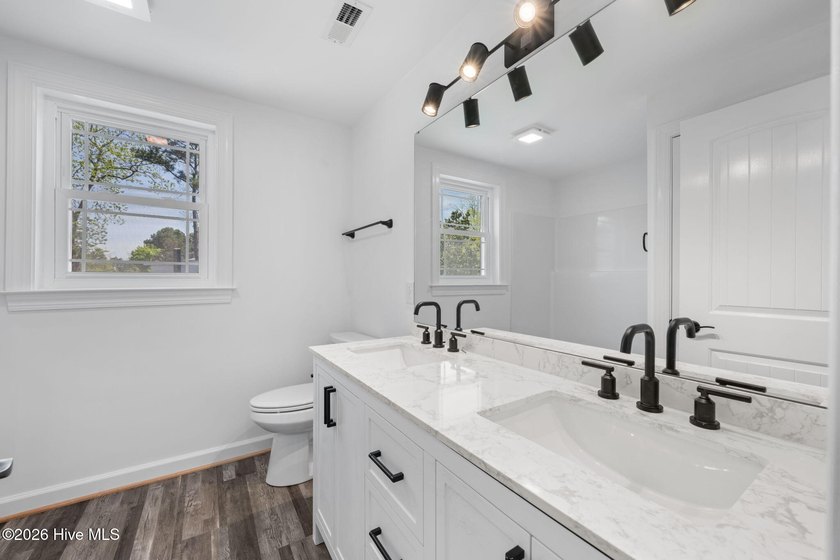 Step into this beautifully restored 1940's home, now with modern - photo 30