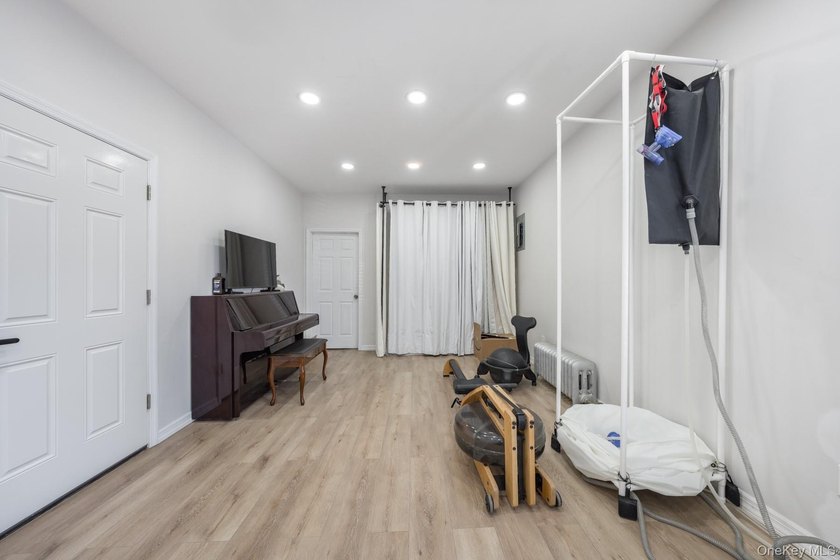 Welcome to this unique three-family home, a strong income - photo 6