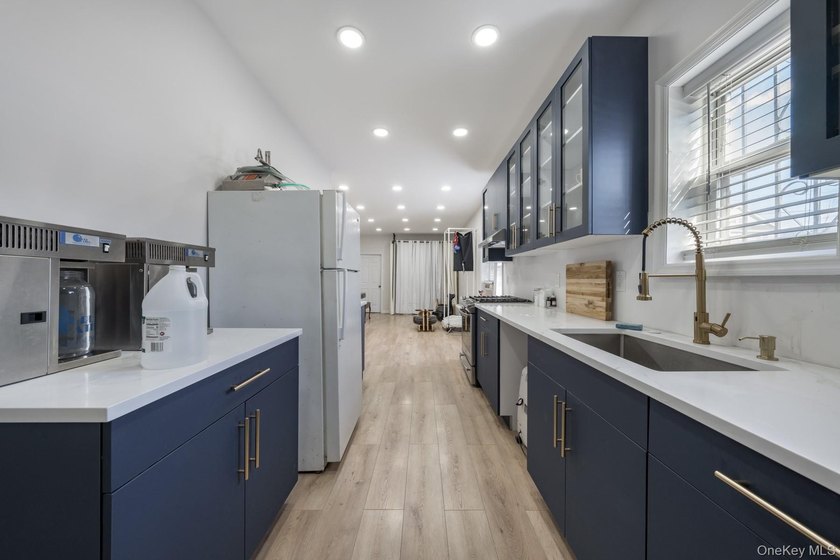 Welcome to this unique three-family home, a strong income - photo 9