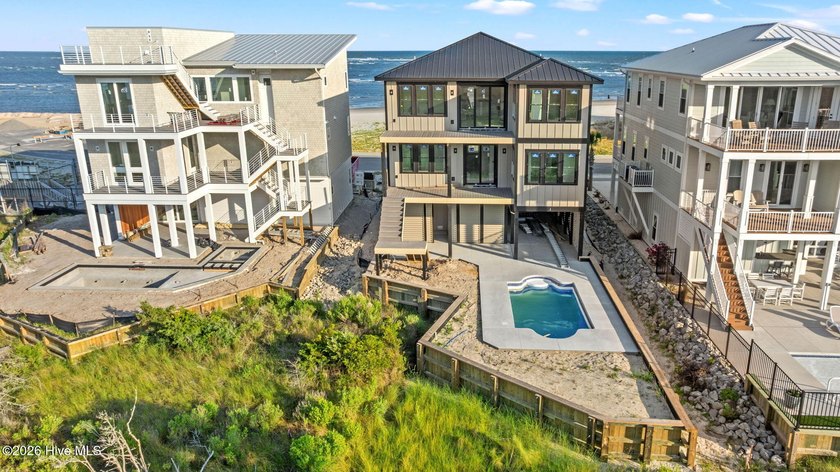 Perched in the highly-coveted gated community of The Pointe at - photo 3