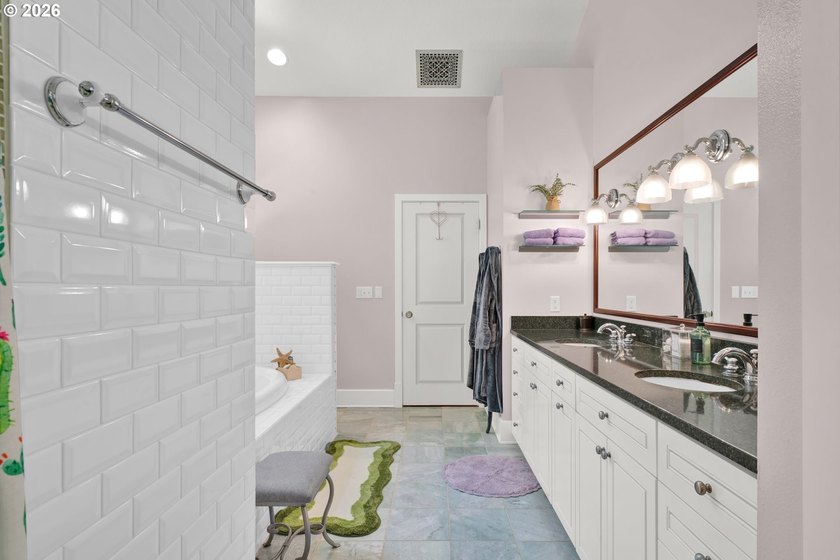Tucked away on over an acre of wooded privacy, this custom - photo 18