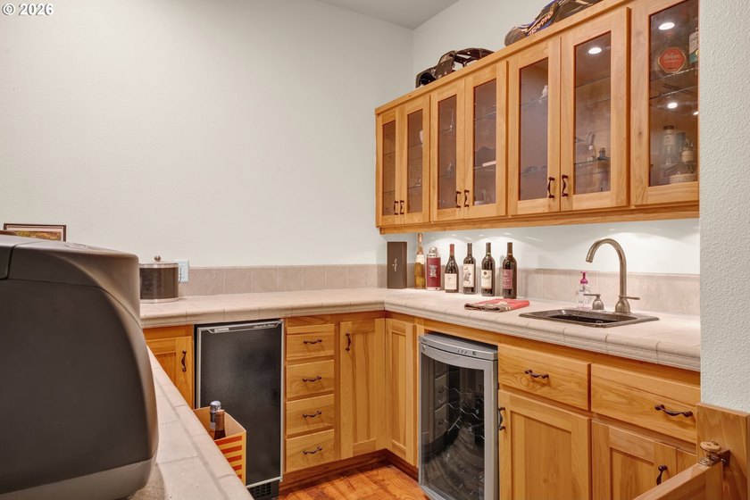Tucked away on over an acre of wooded privacy, this custom - photo 28