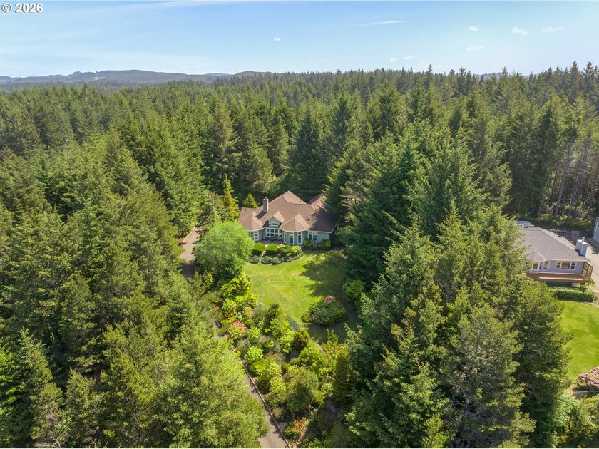 Tucked away on over an acre of wooded privacy, this custom - photo 46