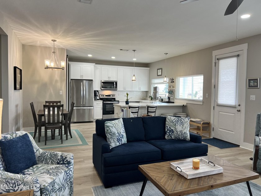 Wake up to coastal breezes and water views in this beautiful - photo 11