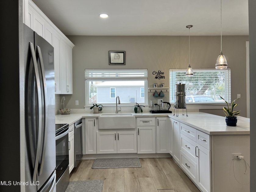 Wake up to coastal breezes and water views in this beautiful - photo 13