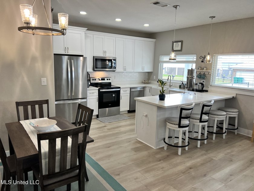 Wake up to coastal breezes and water views in this beautiful - photo 18
