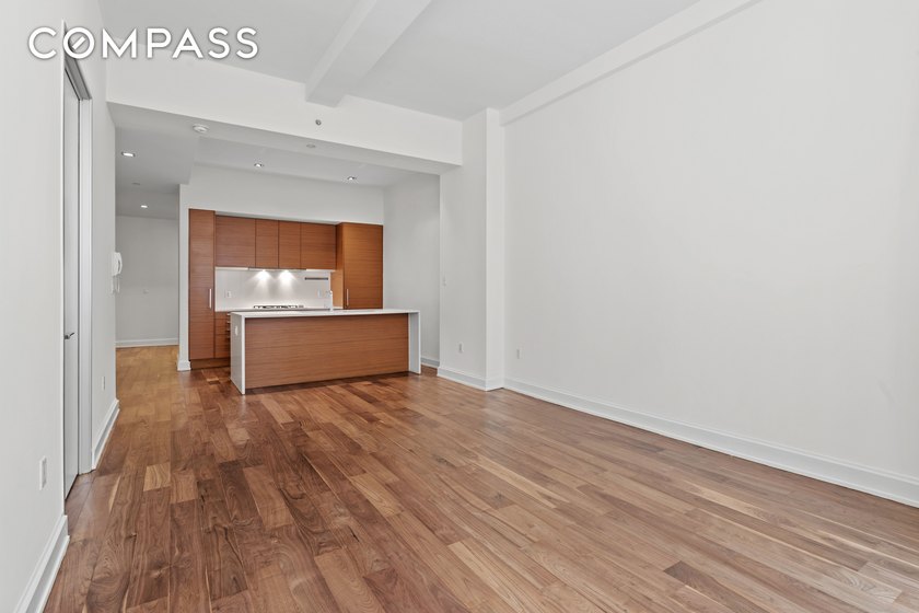 Turnkey loft-style residence with oversized windows overlooking - photo 2