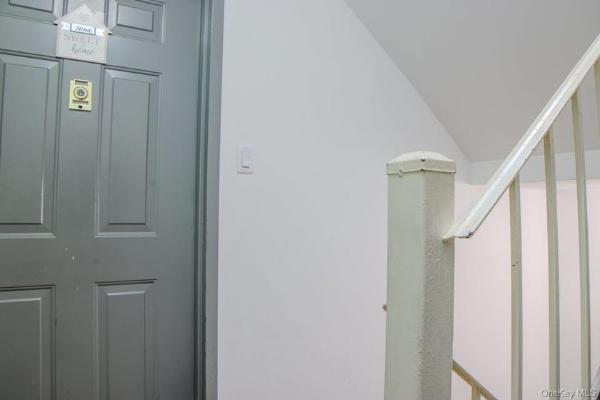 A solid, all-brick attached three story building with three - photo 8