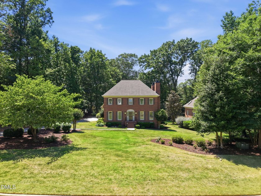 Set on a beautifully landscaped and private 0.51-acre homesite - photo 2