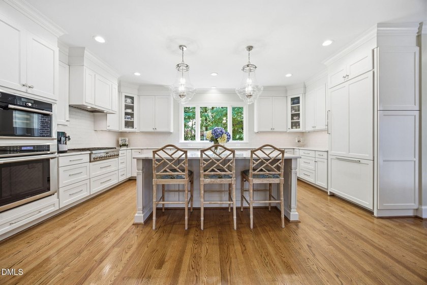 Set on a beautifully landscaped and private 0.51-acre homesite - photo 4