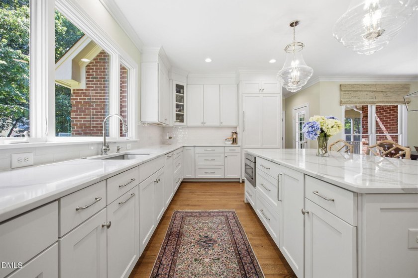 Set on a beautifully landscaped and private 0.51-acre homesite - photo 6