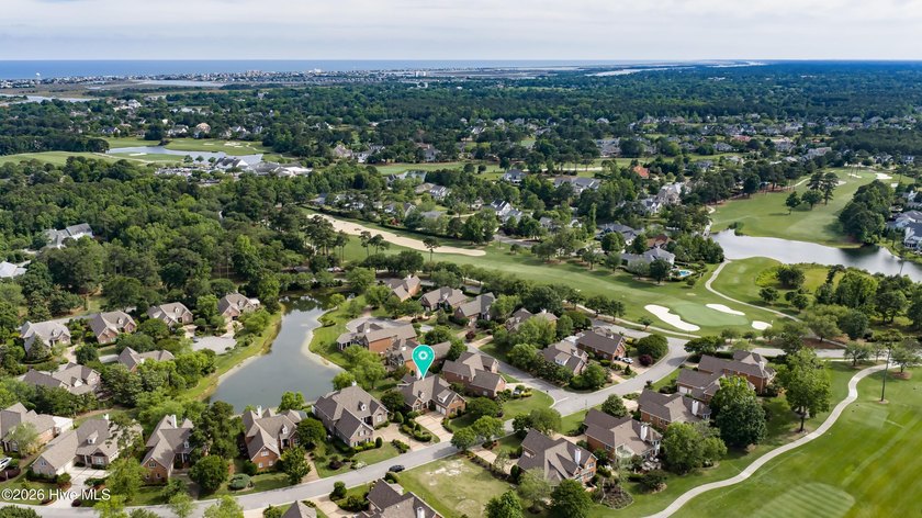 Nestled on a peaceful pond in the gated community of Landfall - photo 3