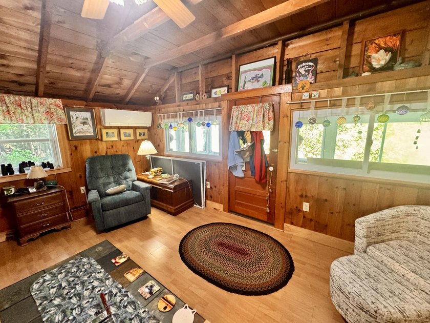 Tucked along the quiet shores of Hart Pond, this charming camp - photo 8