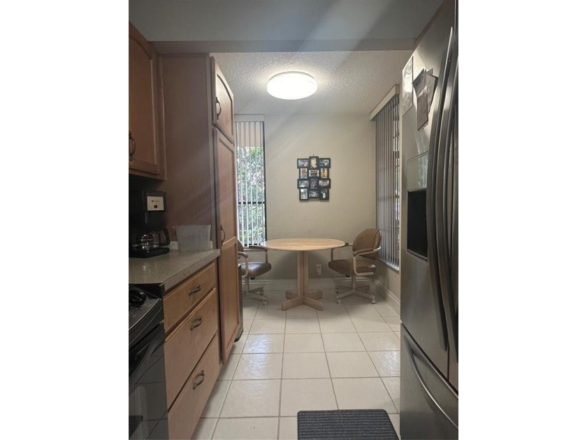 Discover this delightful first-floor unit in the sought-after - photo 13