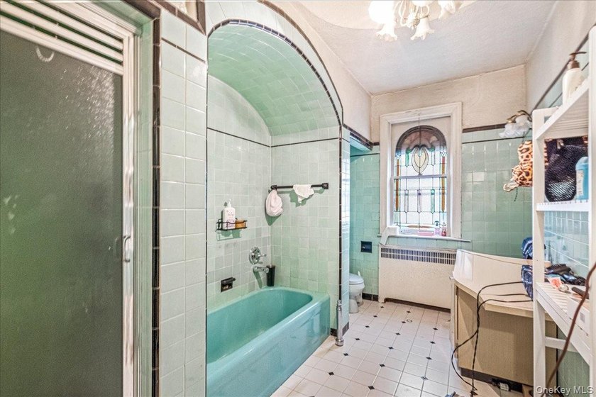 Welcome to 1404 E 49th Street, a semi-detached brick one-family - photo 17