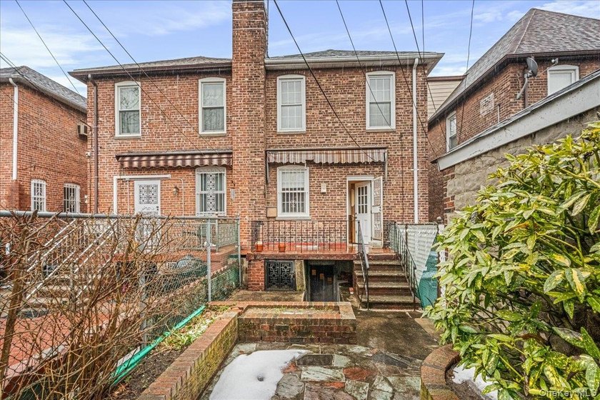 Welcome to 1404 E 49th Street, a semi-detached brick one-family - photo 20