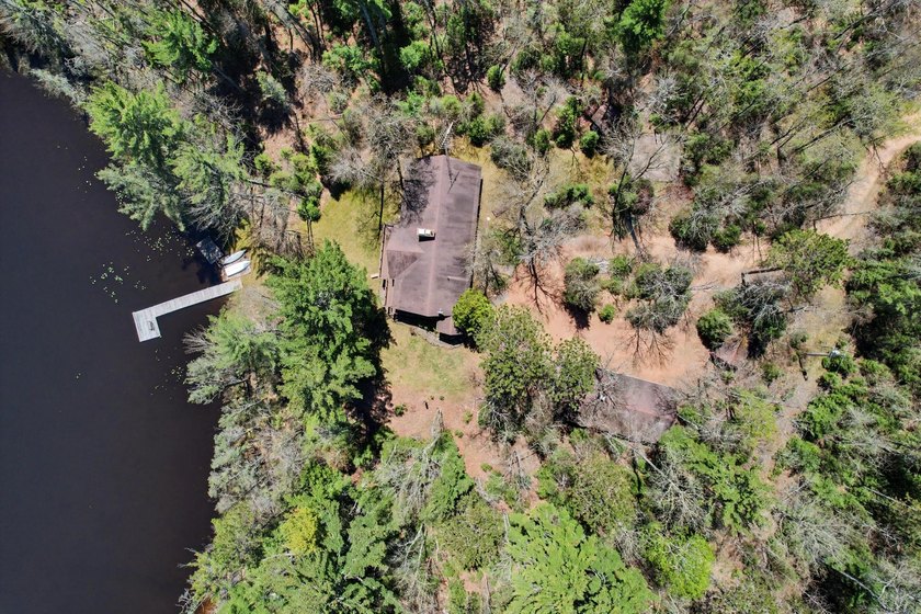 Nestled on nearly 4 private acres along the shores of 54 acre - photo 46