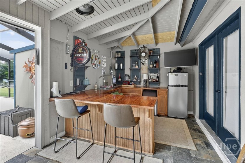 Nestled beneath 22 mature oak trees and surrounded by coastal - photo 44