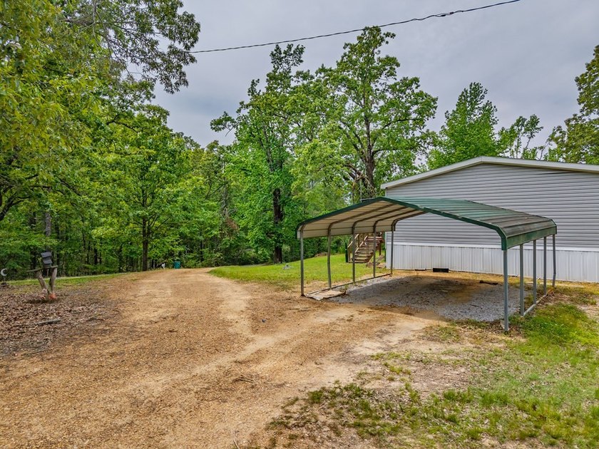 Well-maintained 3 bedroom, 2 bath mobile home on 74 acres. The - photo 32
