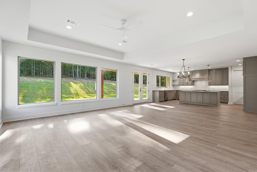 This 4 bed, 3.5 bath home sits on a flat 0.5 acre lot with 115' - photo 13