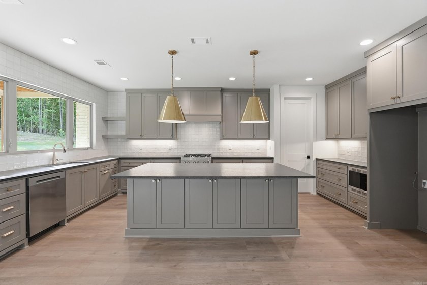 This 4 bed, 3.5 bath home sits on a flat 0.5 acre lot with 115' - photo 18