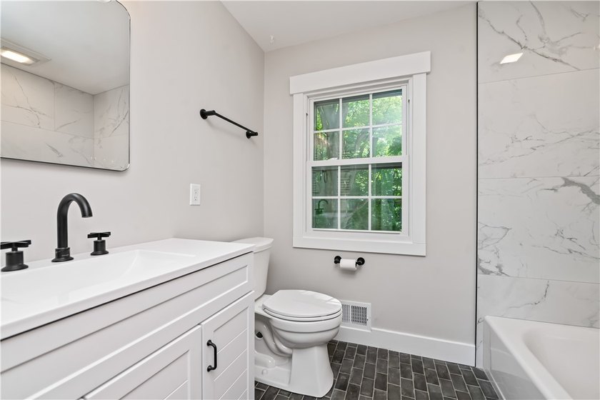 Beautifully updated 4-bedroom, 1.5-bath Colonial nestled on a - photo 25
