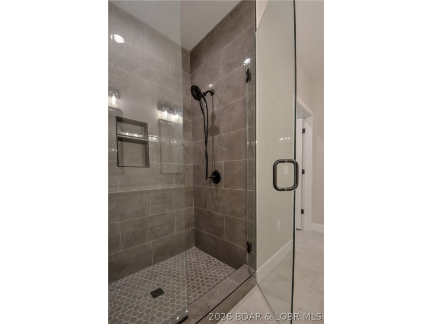 BRAND NEW HOME in the HEART of Osage Beach!! This striking home - photo 30