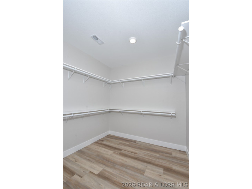 BRAND NEW HOME in the HEART of Osage Beach!! This striking home - photo 33