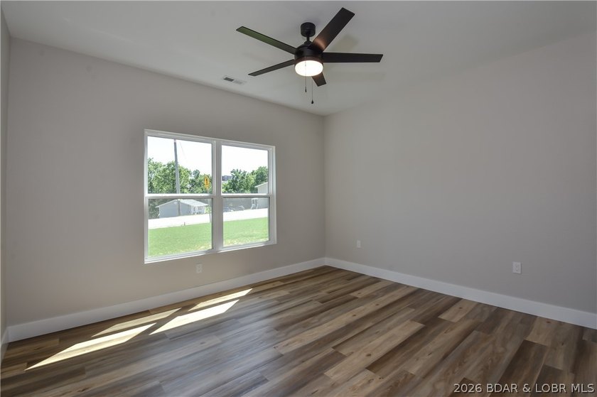 BRAND NEW HOME in the HEART of Osage Beach!! This striking home - photo 34