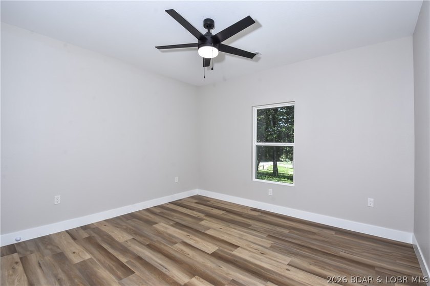 BRAND NEW HOME in the HEART of Osage Beach!! This striking home - photo 35