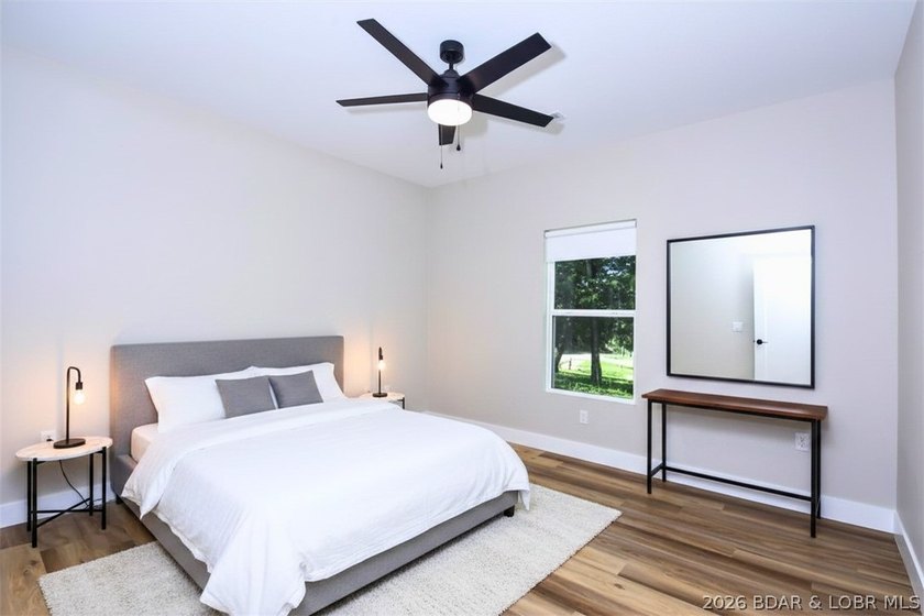 BRAND NEW HOME in the HEART of Osage Beach!! This striking home - photo 36