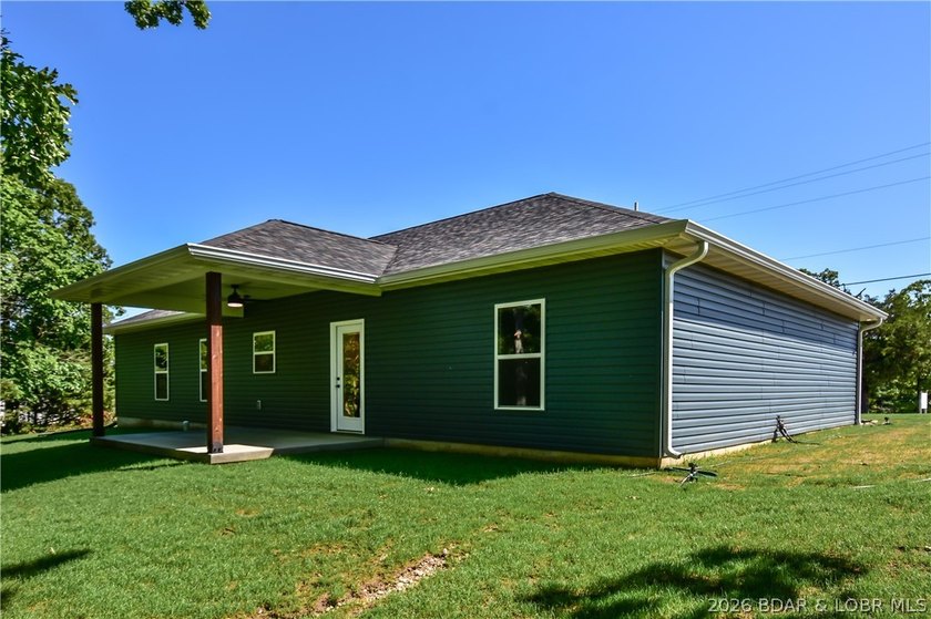 BRAND NEW HOME in the HEART of Osage Beach!! This striking home - photo 39