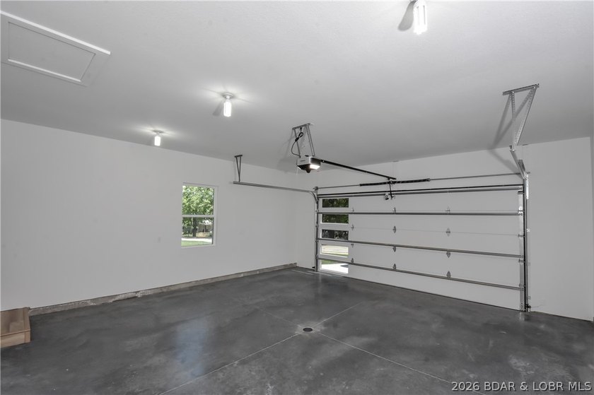 BRAND NEW HOME in the HEART of Osage Beach!! This striking home - photo 40