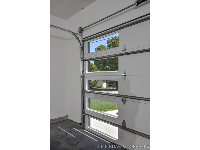 BRAND NEW HOME in the HEART of Osage Beach!! This striking home - photo 41