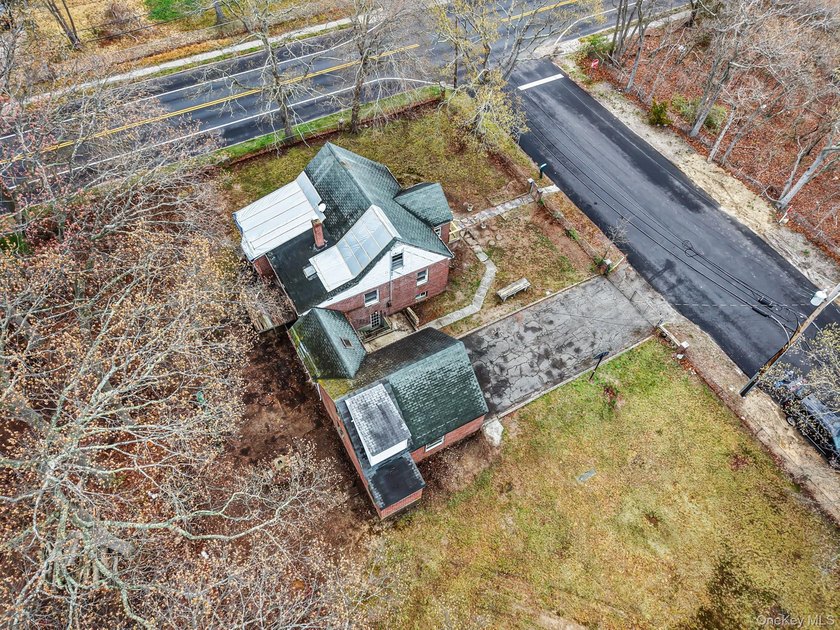 This spacious corner property nestled on a estimated half-acre - photo 41