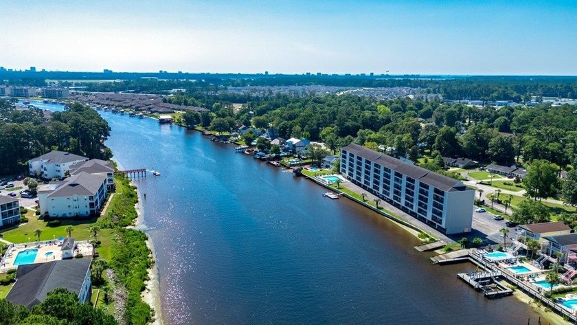 Waterfront luxury meets pristine modern design in this - photo 25