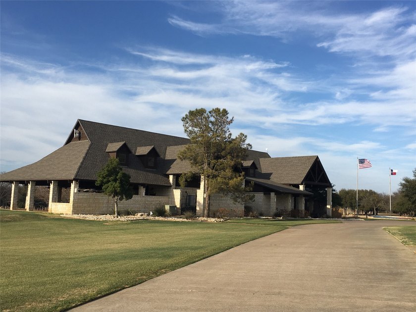 This property is on the new golf course, backs up to tee box # - photo 3