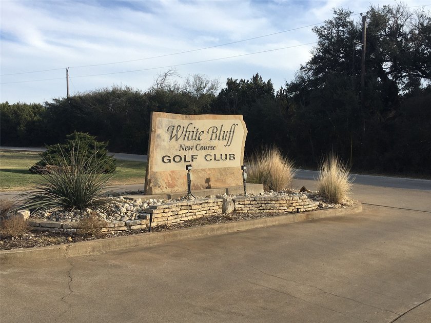 This property is on the new golf course, backs up to tee box # - photo 4