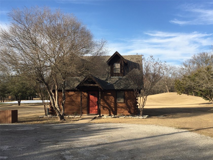 This property is on the new golf course, backs up to tee box # - photo 5