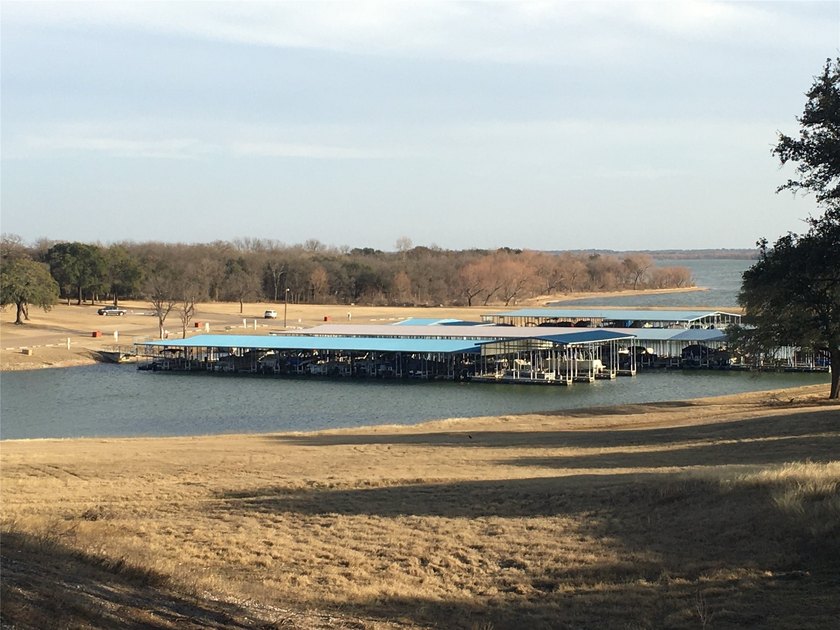 This property is on the new golf course, backs up to tee box # - photo 10