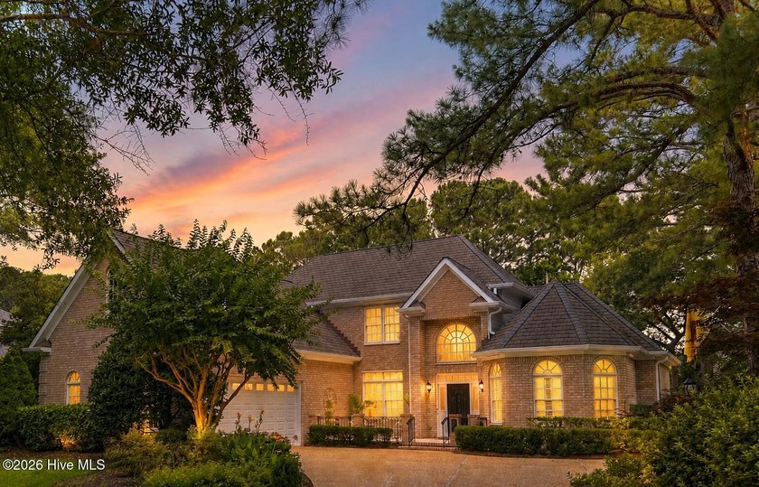 Set within the prestigious community of Landfall, this elegant - photo 2