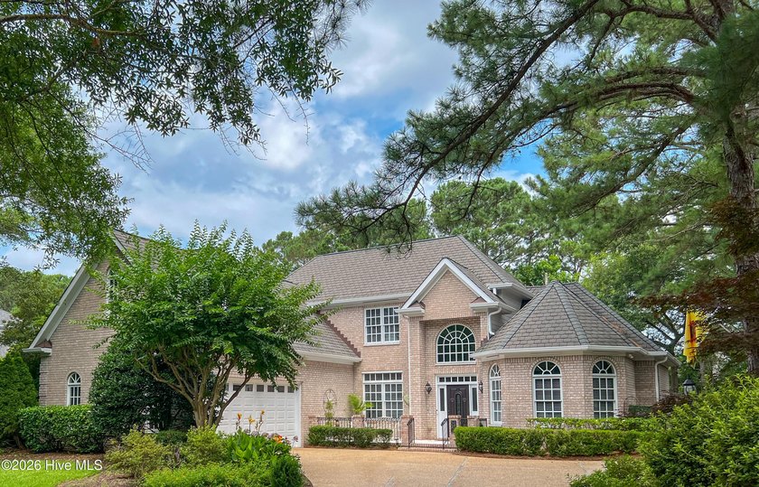 Set within the prestigious community of Landfall, this elegant - photo 3